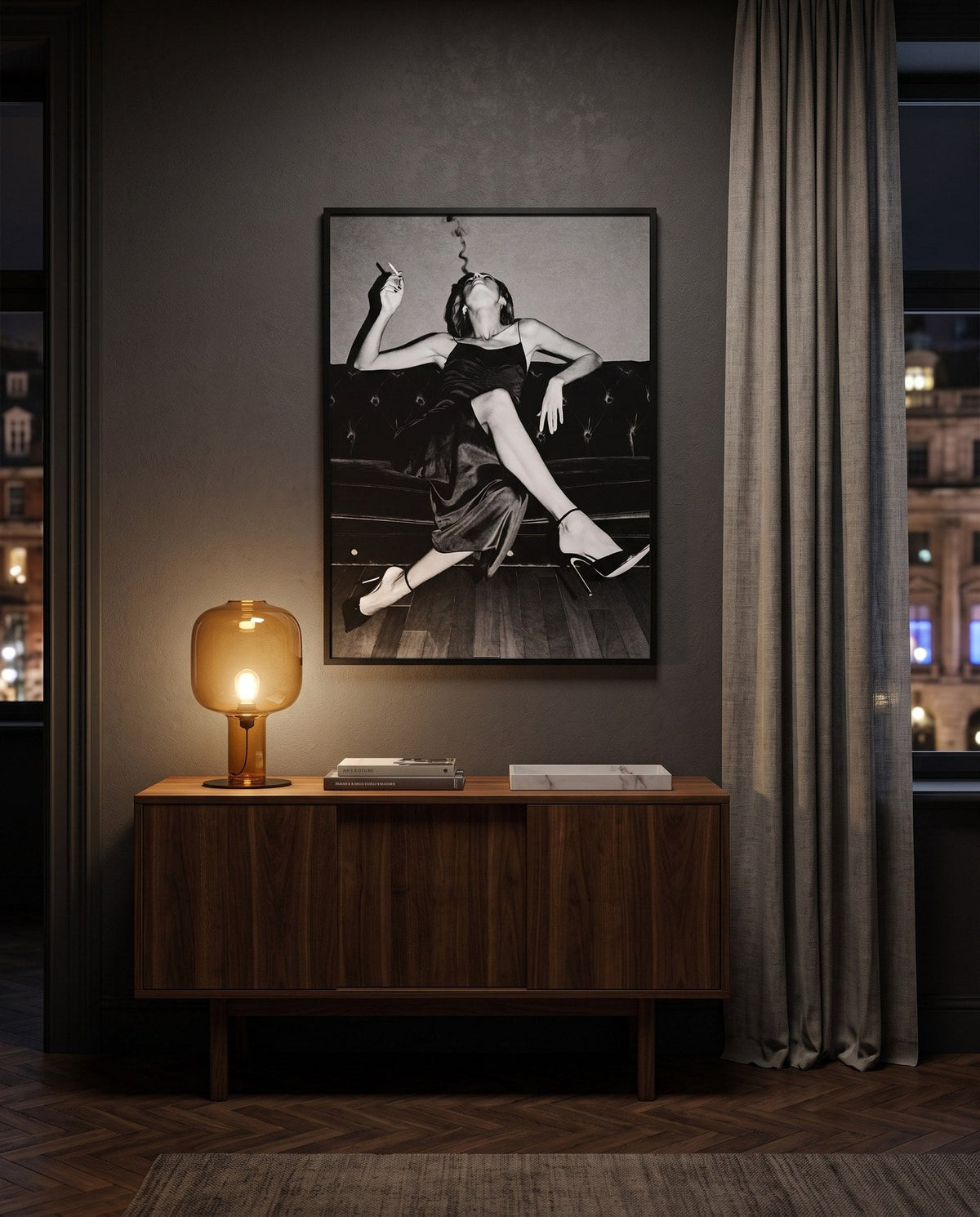 A framed print from the NOTTE series above a walnut console in a London apartment at night